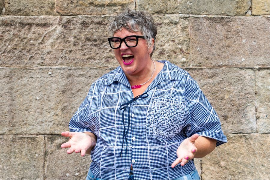 Debbie gesturing in a frustrated manor